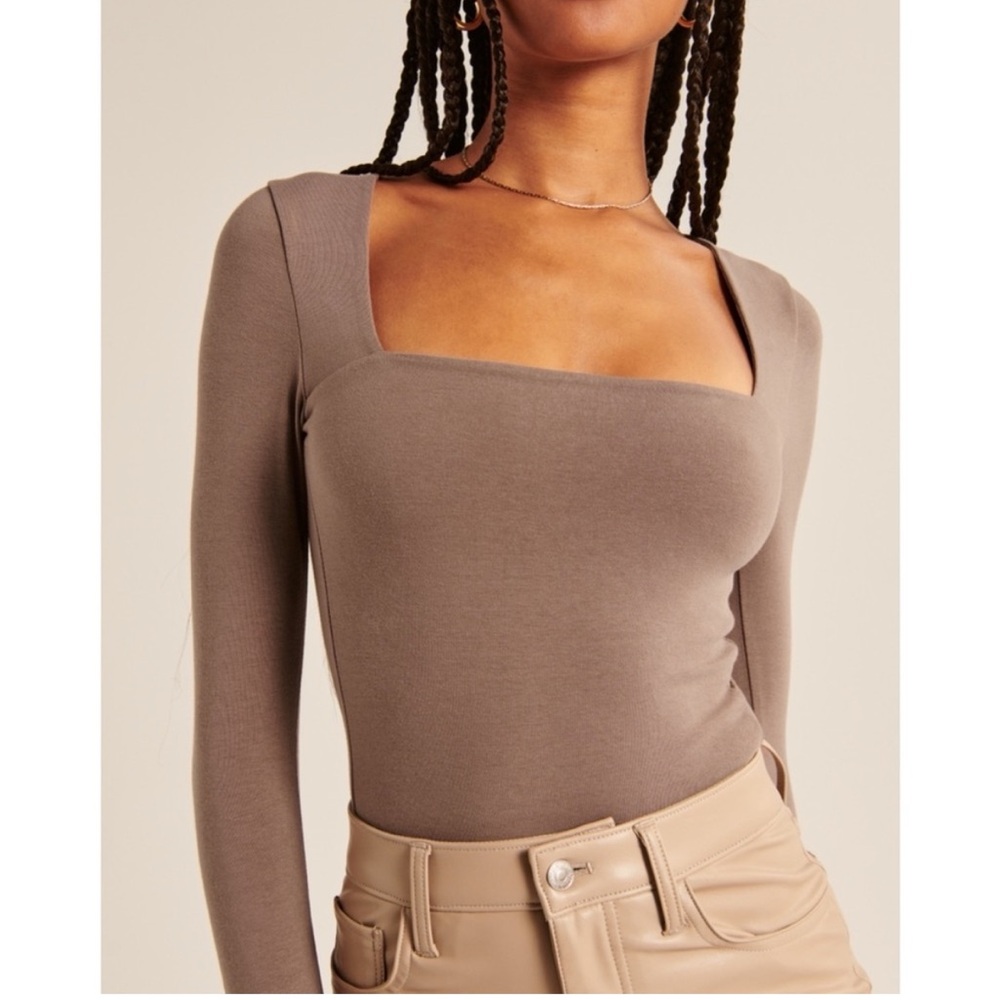 Brown long sleeve fitted bodysuit with square neck and asymmetrical style
